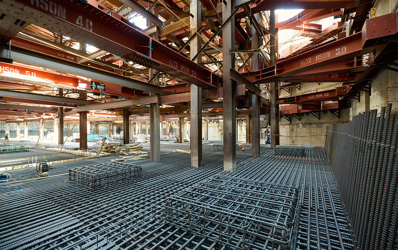 Reinforcing steel bars have been carefully laid throughout the foundation to firmly support the building.